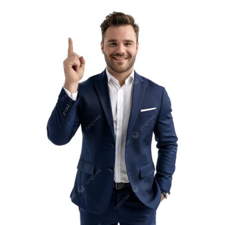 a man in a blue leather jacket posing for a photo