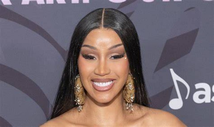 Cardi B shows her growing baby bump in a tee and leggings while out