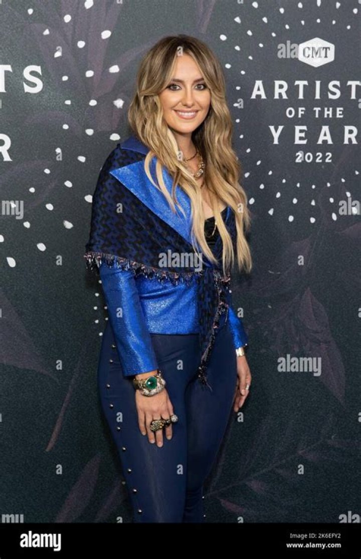 Lainey Wilson Attends The 2022 CMA Awards With Her Father, Brian, By