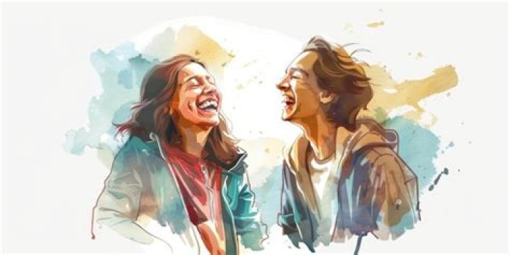 two people are smiling for the camera and one is standing next to